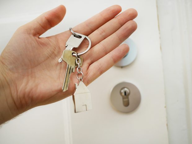 Commercial locksmith services explained - an image of a person holding keys